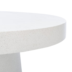 Round pedestal coffee table in white terrazzo faux concrete